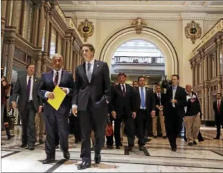  ?? MIKE GROLL — THE ASSOCIATED PRESS ?? Alain Kaloyeros, chief executive officer of the College of Nanoscale Science and Engineerin­g of the State University of New York at Albany, left, and New York Gov. Andrew Cuomo walk at the Smart Cities Technology Innovation Center at Kiernan Plaza on...