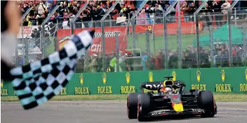  ?? | AFP ?? MAX Verstappen takes the chequered flag at Imola at the Emilia Romagna Grand Prix yesterday.