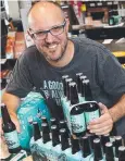  ?? Picture: MARC McCORMACK ?? WINNER: Founder James Grugeon with his beer at BWS in Cairns.