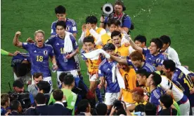  ?? Photograph: Anadolu Agency/ Getty Images ?? Japan’s players celebrate after winning against Germany.