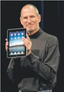  ?? AP PHOTOS ?? Steve Jobs, who co-founded Apple in 1976, presents a Macintosh computer in 1984, an iPhone in 2007, and an iPad in 2010. The company went public in December 1980.