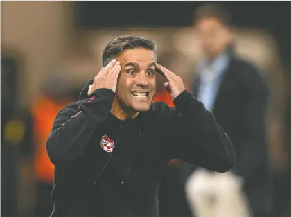  ?? RADOVAN STOKLASA/REUTERS ?? Canada's coach John Herdman, seen during Tuesday's match against Uruguay in Bratislava, Slovakia, has some serious thinking to do between now and the start of the World Cup in Qatar in November, as he whittles down his selection of players from 40 to just 26.