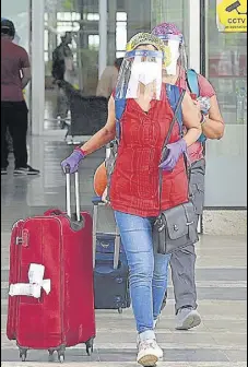  ?? HT PHOTO ?? Passengers leaving Chandigarh Internatio­nal Airport after arriving on a special flight from New Zealand on Monday.