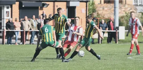  ??  ?? Ryhope CW and North Shields battle for the ball