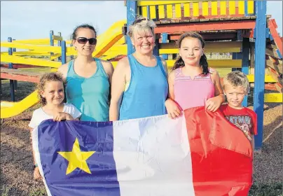  ?? 46#.*55&% 1)050 ?? The first-ever Acadian Festival Road Race will raise funds for a major upgrade to the Evangeline School playground. Seen preparing for the Sept. 2 event are, from left, young volunteer Abigail MacWilliam­s, her mother, race co-director Jennifer...