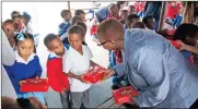  ?? Picture: CORPORATE IMAGE ?? GOODIES: Pupils of HP Williams Primary School in St Helena Bay received a new minibus and back-to-school starter packs from the Oceana Group.