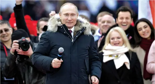  ??  ?? RUSSIAN PRESIDENT Vladimir Putin attends an election rally earlier this month.