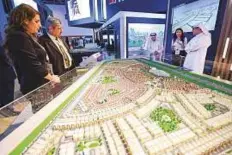  ?? Ahmed Ramzan/Gulf News ?? ■ Visitors at Tilal developmen­t at Tilal stand, during the Real Estate Investment Exhibition, ACRES at Sharjah Expo Centre.