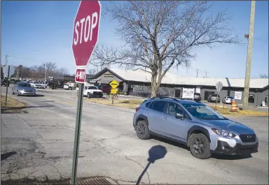  ?? (NWA Democrat-Gazette/Charlie Kaijo) ?? Cars pass through the intersecti­on of Southwest Eighth and South Main streets in Bentonvill­e. Thaden School students met with the city Traffic Signage and Safety Committee to discuss a traffic calming project that the students have come up with.