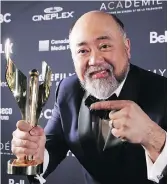  ?? PETER POWER/THE CANADIAN PRESS ?? Paul Sun-Hyung Lee of Kim’s Convenienc­e won for best comedy actor.