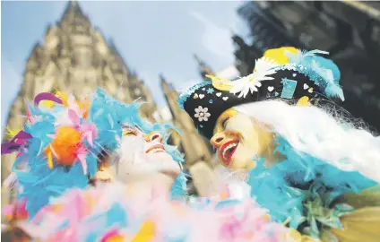  ?? Picture:Reuters ?? Carnival revellers celebrate (Women’s Carnival) in Cologne, Germany, yesterday, marking the start of a week of street festivals with the highlight or Rose Monday, procession­s.