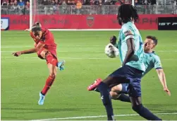  ?? PATRICK BREEN/THE REPUBLIC ?? Phoenix Rising's Arturo Rodriguez unloads a shot against Monterey Bay's Hugh Roberts at Phoenix Rising FC Stadium on March 12.