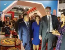  ?? SHI ZHONGYU / XINHUA ?? Serbian President Aleksandar Vucic (second from right) and Chinese Ambassador to Serbia Chen Bo (third from right) visit the Chinese exhibition booth of the 44th Belgrade Internatio­nal Tourism Fair in Belgrade, Serbia, on Feb 22. The president extended his welcome to Chinese tourists on Feb 22 at the opening of the tourism fair, where China is the guest of honor for the first time.