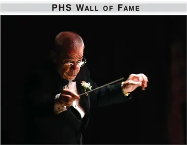  ?? RECORDER FILE PHOTOS BY CHIEKO HARA ?? Band director Jim Kusserow conducts the Panther Band concert at Frank "Buck" Shaffer theater inside of the Portervill­e Memorial Auditorium last year. He is being inducted into the PHS Wall of Fame.