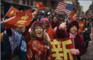  ?? ANDRES KUDACKI—ASSOCIATED PRESS ?? Revelers march and shout to the crowd during the Chinese Lunar New Year parade in Chinatown in New York, Sunday, Feb. 17, 2019.