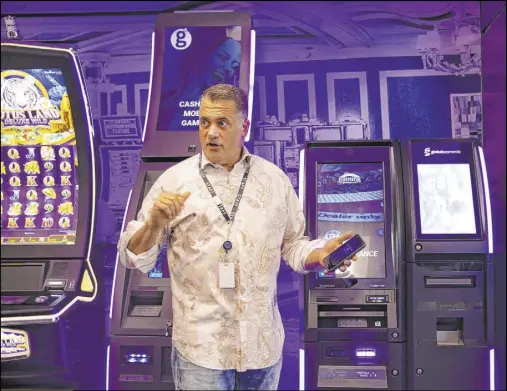  ?? Rachel Aston Las Vegas Review-Journal @rookie__rae ?? Global Payments Gaming Solutions President Christophe­r Justice discusses cashless payment technology for casinos.