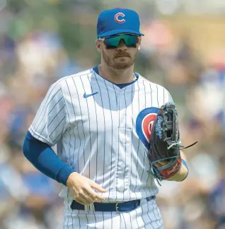  ?? ERIN HOOLEY/CHICAGO TRIBUNE ?? Cubs left fielder Ian Happ heads in from the outfield during the first inning of a game at Wrigley Field on July 26.