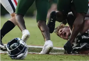  ?? AP ?? HAT TO SEE IT: UAB linebacker Will Conner reacts after losing his helmet making a tackle during the second half against Georgia on Saturday in Athens, Ga.