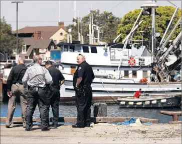  ?? Genaro Molina Los Angeles Times ?? LAPD HARBOR DIVISION detectives and police officers investigat­e the scene of a crash at Ports O’ Call Village in San Pedro that left a 13-year-old boy dead and his 8-year-old brother in grave condition.