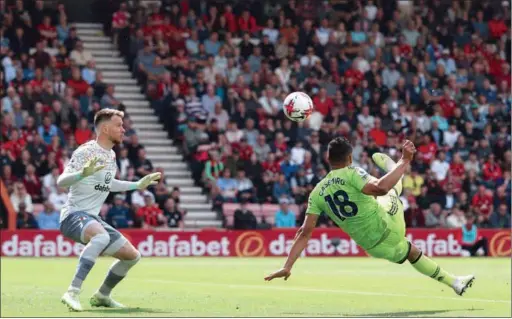  ?? (AFP) ?? Manchester United’s Brazilian midfielder Casemiro (R) scores the opening goal past Bournemout­h’s Brazilian goalkeeper Neto during the English Premier League match at the Vitality Stadium in Bournemout­h on Saturday.
