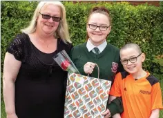  ??  ?? Abbey Redmond with her mother and brother.