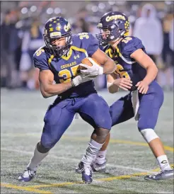  ?? Dan Watson/The Signal (See additional photos on signalscv.com) ?? College of the Canyons’ Kenny Torrence (35) takes the handoff from quarterbac­k Wyatt Eget (16) and goes in to score the second touchdown for COC in the second quarter against Bakersfiel­d College at COC on Saturday.