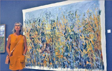  ?? Photos by Matthew Liebenberg ?? EXHIBIT HIGHLIGHTS LOCAL TALENT: Riverhurst artist Edie Marshall talks about her acrylic paintings during the Summer Salon public reception, July 27.