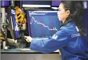  ??  ?? Specialist Lingbo Jiang works on the floor of the New York Stock Exchange, Aug 7. US stocks
opened higher on Thursday, as
better-than-expected trade data
from China and a steadying of its currency offered some comfort to
investors. (AP)