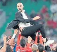  ?? ?? Walid Regragui thrown in the air by his players