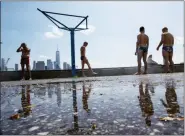  ?? EDUARDO MUNOZ ALVAREZ — THE ASSOCIATED PRESS ?? People cool off at Pier 45 on Saturday in New York. Temperatur­es in the high 90s are forecast for Saturday and Sunday with a heat index well over 100. Much of the nation is also dealing with high heat.