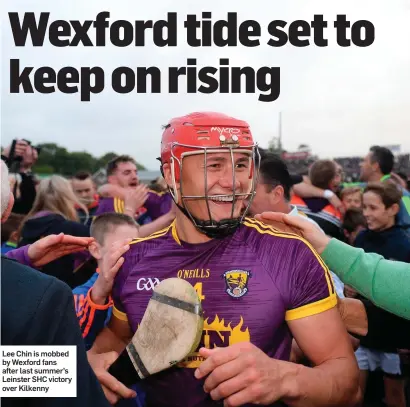  ??  ?? Lee Chin is mobbed by Wexford fans after last summer’s Leinster SHC victory over Kilkenny