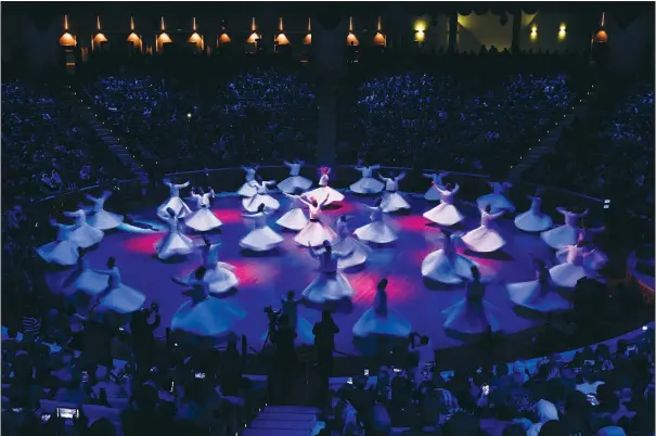  ?? (AP/Francisco Seco) ?? Whirling dervishes of the Mevlevi order perform Dec. 17 during a Sheb-i Arus ceremony in Konya, central Turkey.