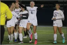  ?? BRYAN EVERSON — MEDIANEWS GROUP ?? Clarkston senior midfielder Emma Bradley (5) celebrates with teammates after the completion of Friday night’s win at Rochester. Bradley scored the game-winning goal with 1:19 remaining.