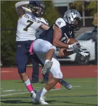  ?? PETE BANNAN — MEDIANEWS GROUP ?? Malvern Prep’s Isaac White (12) hauls in a second quarter touchdown pass from Lonnie White as Penn Charter’s Aaron Maione defends.