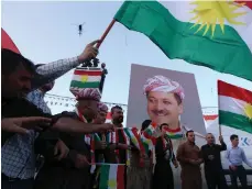  ?? AFP ?? Iraqi Kurds in Erbil urge people to vote in the Kurdistan region’s independen­ce referendum on September 25