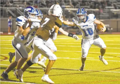  ?? APRIL GAMIZ/THE MORNING CALL ?? Palmerton’s James Denicola (10) ran for three touchdowns and returned a fumble for a score in a 47-7 win over Catasauqua in Saturday night’s District 11 Class 2A semifinal.
