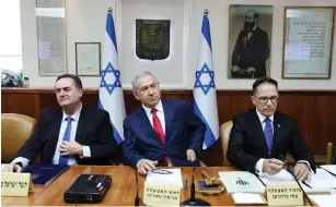  ?? (Abir Sultan/Pool/Reuters) ?? PRIME MINISTER Benjamin Netanyahu, cabinet secretary Tzachi Braverman and Foreign Affairs Minister Israel Katz attend the weekly cabinet meeting in Jerusalem.