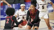  ?? SEAN RAYFORD — THE ASSOCIATED PRESS ?? South Carolina guard Destanni Henderson (3) defends Georgia forward Jordan Isaacs (20) and Gabby Connally (2) during the first half of the Southeaste­rn Conference tournament final on Sunday in Greenville, S.C.