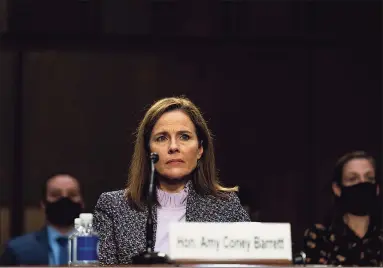  ?? Pool / Getty Images ?? Supreme Court nominee Judge Amy Coney Barrett testifies before the Senate Judiciary Committee on the third day of her Supreme Court confirmati­on hearing on Capitol Hill on Wednesday in Washington, D.C. Barrett was nominated by President Donald Trump to fill the vacancy left by Justice Ruth Bader Ginsburg who passed away in September.