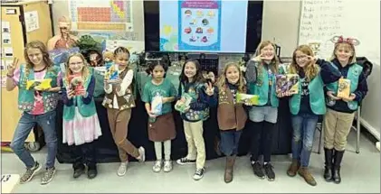  ?? COURTESY OF NENA THORNBURG ?? Members of Tehachapi Girl Scout Troop 8014 will sell cookies through March 19.