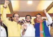  ?? PTI FILE ?? (From left) Shiv Sena chief Uddhav Thackeray, party leader Aaditya Thackeray and Maharashtr­a CM Devendra Fadnavis.