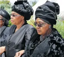  ?? Ap phoTo/elmonD Jiyane, gCis ?? Winnie Madikizela-Mandela, right, the former wife of Nelson Mandela, and his widow Graça Machel depart Sunday’s service for the burial site in Qunu. Mandela grew up in Qunu and returned there in his later years.