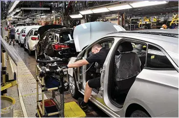  ??  ?? BOOST: Production line at Vauxhall’s Ellesmere Port plant, where electric vehicles will be made