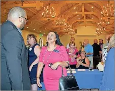  ?? File Photo ?? In this Sept. 21, 2018 photo, Terrance White (left) greets featured speaker state Sen. Nikema Williams at the Floyd County Democratic Party’s annual Georgia Giants Dinner. Williams was selected Monday to replace the late U.S. Rep John Lewis on the November ballot.