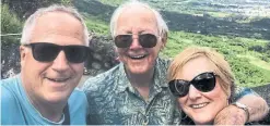  ??  ?? Jim Byers, left, his father Robert and his sister Christine in Oahu in 2018.