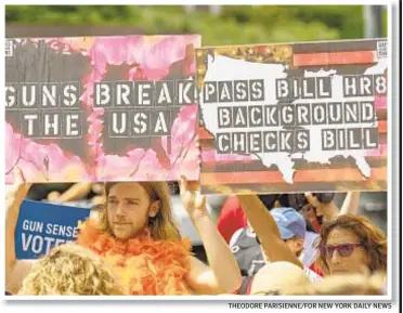  ?? THEODORE PARISIENNE/FOR NEW YORK DAILY NEWS ?? Protesters at downtown’s Foley Square demand Sunday that Senate Majority Leader Mitch McConnell call the Senate out of recess and vote on a pair of gun control measures.