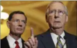  ?? JACQUELYN MARTIN — ASSOCIATED PRESS ?? Senate Majority Leader Mitch McConnell of Ky., right, accompanie­d by Sen. John Barrasso, R-Wyo., meets with reporters on Capitol Hill in Washington, Tuesday following after a Republican policy luncheon.