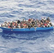  ??  ?? Irregular migrants off Libya are seen in the Mediterran­ean Sea, July 18, 2021.
