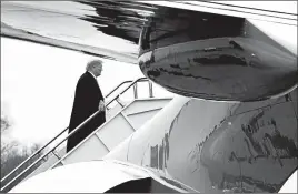  ?? JACQUELYN MARTIN/AP ?? President Donald Trump boards Air Force One after addressing the American Farm Bureau Federation convention in New Orleans, where he defended holding out for wall funding.