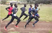  ??  ?? Paulo Amotun Kokoro, left foreground, runs during a training session last month in Ngong, Kenya. Kokoro is one of five runners from South Sudan who grew up in a refugee camp and are part of the IOC’s first refugee team that will be competing at the Rio...